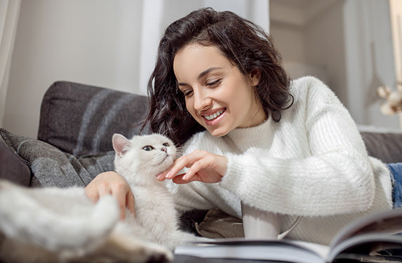white cat with lady owner