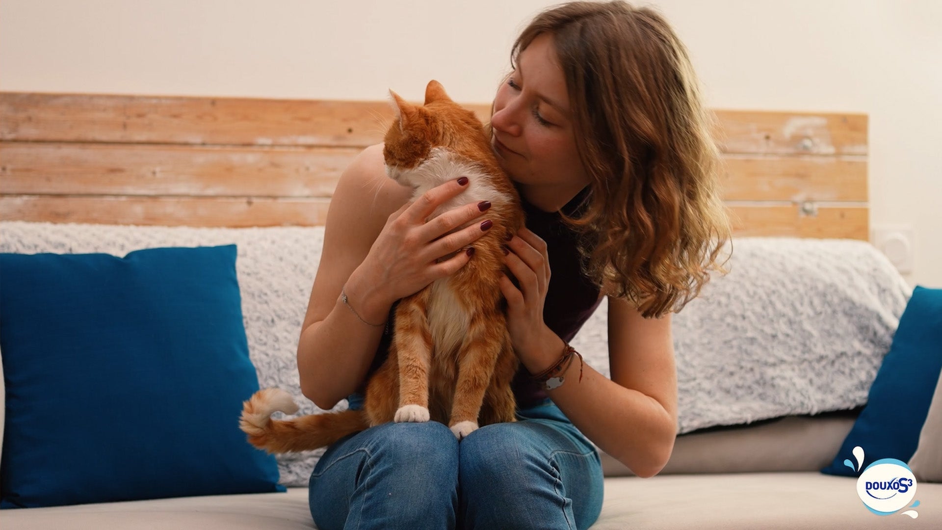 Lady holding ginger cat